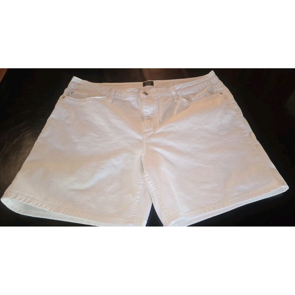 Lee brand white denim Bermuda shorts feature a classic five-pocket design and a